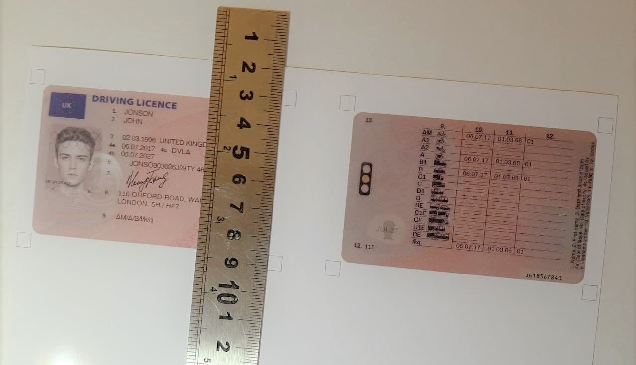 Cutting the printed document with a utility knife and ruler
